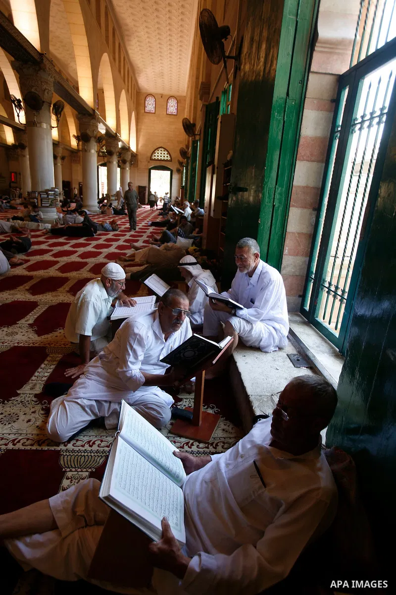 Palestinians read the holy Qur'an at al-Aqsa Mosque in Jerusalem's Old City during the holy month of Ramadan, on 26 July 2012. Muslims around the world abstain from eating, drinking and conducting sexual relations from d...