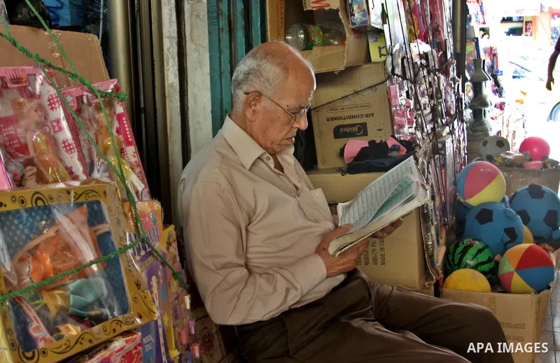 A Palestinian man reads the holy Qur'an in his shop in the West Bank city of Nablus, on Aug. 06 2012. Muslims around the world refrain from eating, drinking and sexual intercourse from dawn till dusk during Ramadan, the...