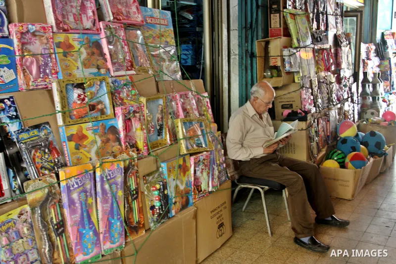 A Palestinian man reads the holy Qur'an in his shop in the West Bank city of Nablus, on Aug. 06 2012. Muslims around the world refrain from eating, drinking and sexual intercourse from dawn till dusk during Ramadan, the...