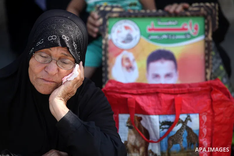 Palestinian relatives prisoners attend a protest calling for the release of their sons held in Israeli jails in front of the headquarters Red Cross in Gaza City, Gaza Strip, on Aug.06, 2012. Photo by Majdi Fathi