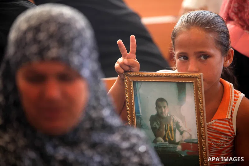 Palestinian relatives prisoners attend a protest calling for the release of their sons held in Israeli jails in front of the headquarters Red Cross in Gaza City, Gaza Strip, on Aug.06, 2012. Photo by Majdi Fathi