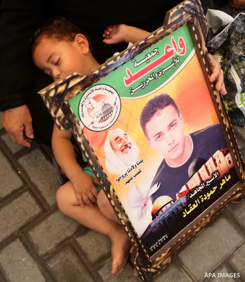 Palestinian relatives prisoners attend a protest calling for the release of their sons held in Israeli jails in front of the headquarters Red Cross in Gaza City, Gaza Strip, on Aug.06, 2012. Photo by Majdi Fathi