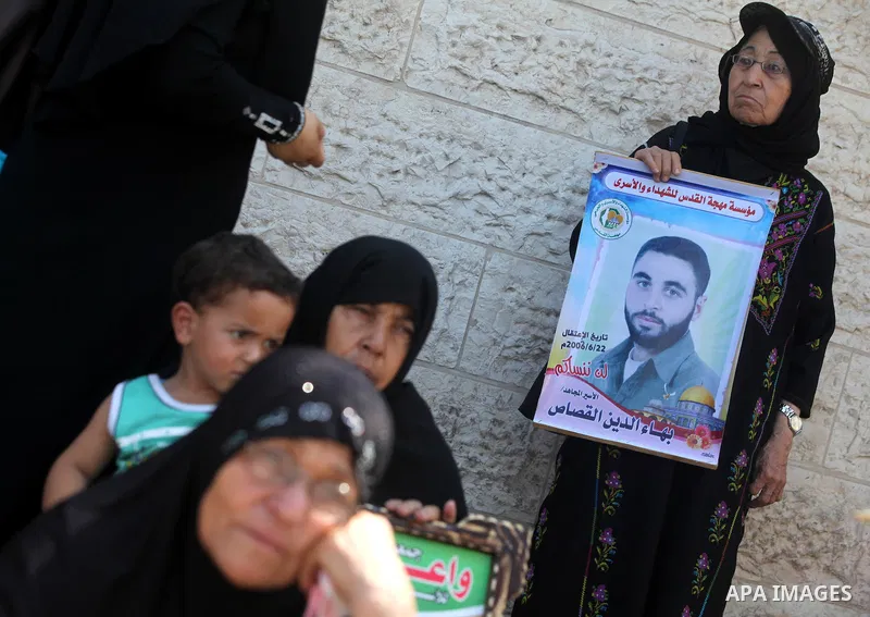 Palestinian relatives prisoners attend a protest calling for the release of their sons held in Israeli jails in front of the headquarters Red Cross in Gaza City, Gaza Strip, on Aug.06, 2012. Photo by Majdi Fathi