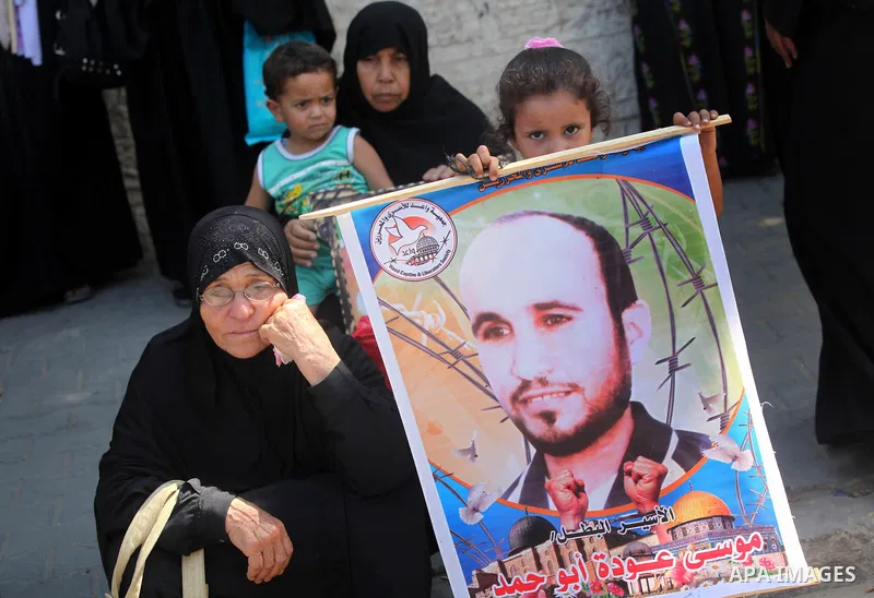 Palestinian relatives prisoners attend a protest calling for the release of their sons held in Israeli jails in front of the headquarters Red Cross in Gaza City, Gaza Strip, on Aug.06, 2012. Photo by Majdi Fathi