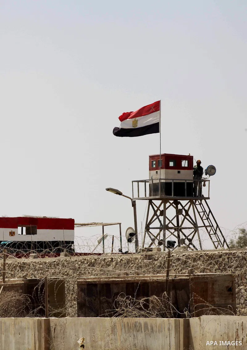 Egyptian soldiers stand guard on the border between Egypt and the southern Gaza Strip, near Rafah August 6, 2012. Egypt branded Islamist gunmen who killed 16 police near the Israeli border as "infidel" and promised on Mo...