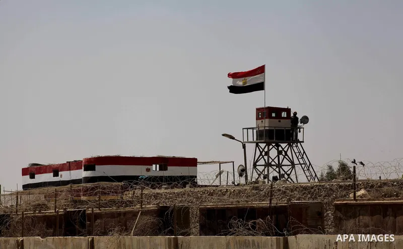 Egyptian soldiers stand guard on the border between Egypt and the southern Gaza Strip, near Rafah August 6, 2012. Egypt branded Islamist gunmen who killed 16 police near the Israeli border as "infidel" and promised on Mo...
