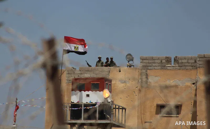 Egyptian soldiers stand guard on the border between Egypt and the southern Gaza Strip, near Rafah August 6, 2012. Egypt branded Islamist gunmen who killed 16 police near the Israeli border as "infidel" and promised on Mo...