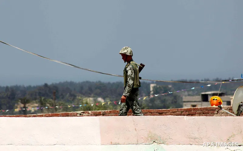 Egyptian soldiers stand guard on the border between Egypt and the southern Gaza Strip, near Rafah August 6, 2012. Egypt branded Islamist gunmen who killed 16 police near the Israeli border as "infidel" and promised on Mo...