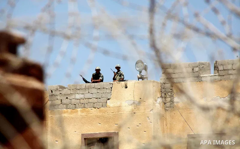 Egyptian soldiers stand guard on the border between Egypt and the southern Gaza Strip, near Rafah August 6, 2012. Egypt branded Islamist gunmen who killed 16 police near the Israeli border as "infidel" and promised on Mo...