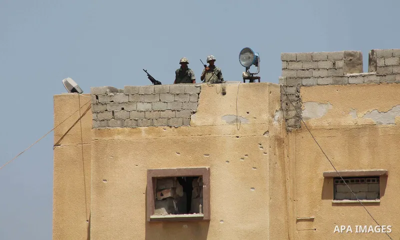 Egyptian soldiers stand guard on the border between Egypt and the southern Gaza Strip, near Rafah August 6, 2012. Egypt branded Islamist gunmen who killed 16 police near the Israeli border as "infidel" and promised on Mo...