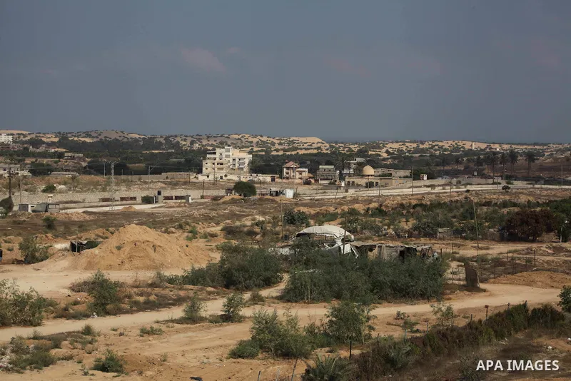 Tents cover entrances of tunnels (bottom) used for smuggling along the Gaza-Egypt border, near the southern Gaza Strip town of Rafah on August 06, 2012. Five gunmen who slew 16 Egyptian guards near the border with Israel...