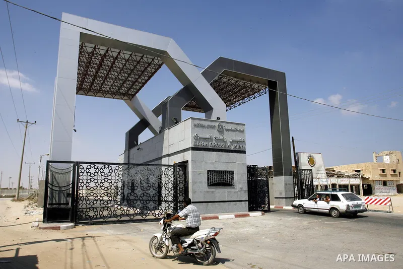 A Palestinian man rides a motorcycle outside the Rafah border crossing between southern Gaza Strip and Egypt, Monday, Aug. 6, 2012. Egypt has closed the terminal, the only gateway for Gaza's people after the deadly attac...
