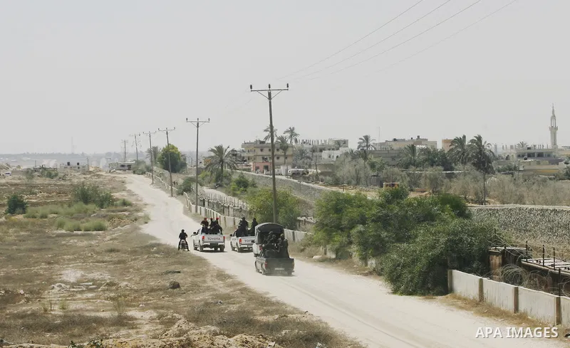 Palestinian security forces stand guard on the border between Egypt and the southern Gaza Strip, near Rafah August 6, 2012. Egypt has closed the terminal, the only gateway for Gaza's people after the deadly attack on its...
