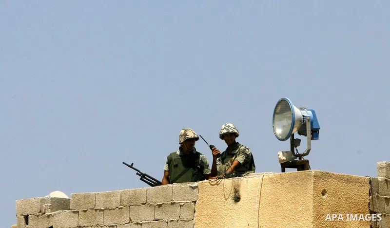 Egyptian soldiers stand guard on the border between Egypt and the southern Gaza Strip, near Rafah August 6, 2012. Egypt has closed the terminal, the only gateway for Gaza's people after the deadly attack on its soldiers...