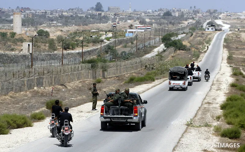 Palestinian security forces stand guard on the border between Egypt and the southern Gaza Strip, near Rafah August 6, 2012. Egypt has closed the terminal, the only gateway for Gaza's people after the deadly attack on its...