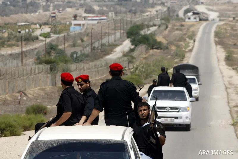 Palestinian security forces stand guard on the border between Egypt and the southern Gaza Strip, near Rafah August 6, 2012. Egypt has closed the terminal, the only gateway for Gaza's people after the deadly attack on its...