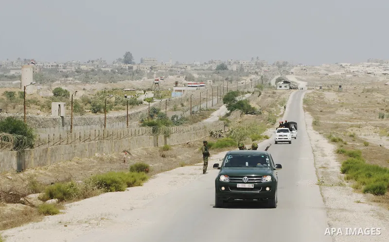 Palestinian security forces stand guard on the border between Egypt and the southern Gaza Strip, near Rafah August 6, 2012. Egypt has closed the terminal, the only gateway for Gaza's people after the deadly attack on its...