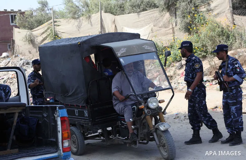 Palestinians Hamas security guard during searching cars near the border between Egypt and Gaza strip in Rafah town southern Gaza strip on, 06 August 2012. Reports state that at least five gunmen were killed after they tr...