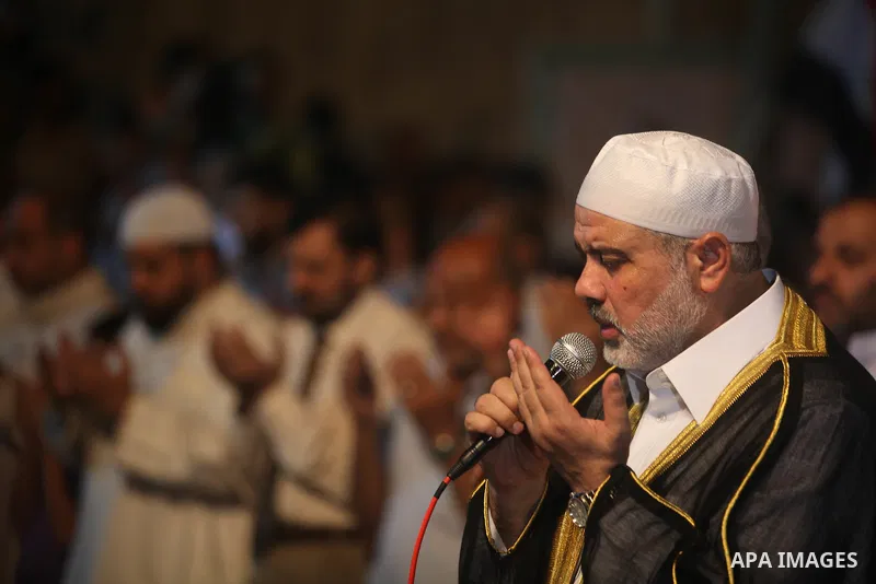 Palestinian Prime Minister in Gaza Ismail Haniyeh leads a night prayer known as "Tarawih" at a sit-in tent in Gaza city, solidarity with Egyptian soldiers who were killed on Rafah border between Egypt and the southern Ga...