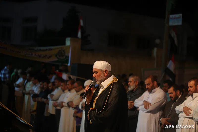 Palestinian Prime Minister in Gaza Ismail Haniyeh leads a night prayer known as "Tarawih" at a sit-in tent in Gaza city, solidarity with Egyptian soldiers who were killed on Rafah border between Egypt and the southern Ga...