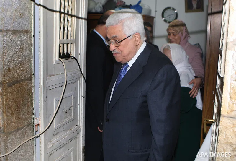 Palestinian President Mahmoud Abbas (Abu Mazen) visits a Palestinian indigent family during the holy month of Ramadan, in the West Bank city of Ramallah on 06 August 2012. Photo by Thaer Ganaim