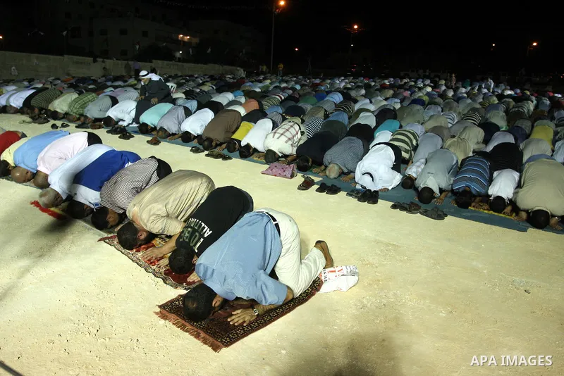 Palestinian Muslims perform a night prayer known as "Tarawih" at the mosque in the West Bank city of Ramallah on Aug. 07, 2012. Photo by Issam Rimawi