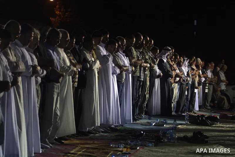 Palestinian Muslims perform a night prayer known as "Tarawih" at the mosque in the West Bank city of Ramallah on Aug. 07, 2012. Photo by Issam Rimawi