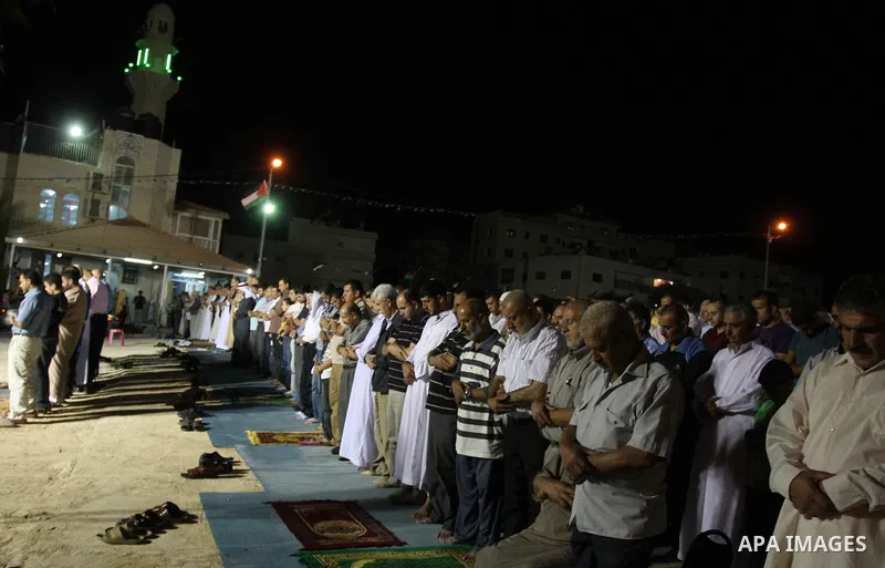 Palestinian Muslims perform a night prayer known as "Tarawih" at the mosque in the West Bank city of Ramallah on Aug. 07, 2012. Photo by Issam Rimawi
