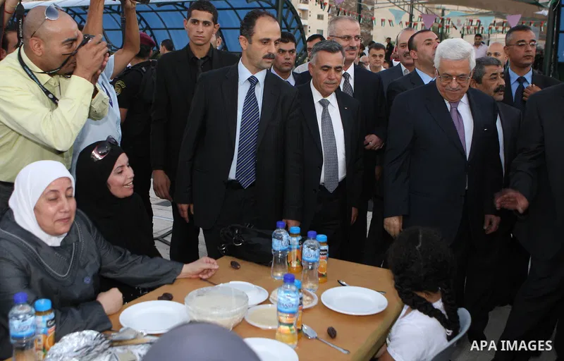 Palestinian President, Mahmoud Abbas (Abu Mazen), participates in breakfast with the group of Palestinian orphans in the West Bank city of Nablus on, Aug. 07, 2012. Photo by Thaer Ganaim