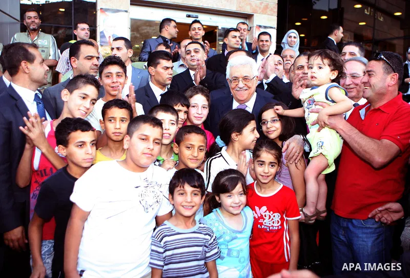 Palestinian President, Mahmoud Abbas (Abu Mazen), participates in breakfast with the group of Palestinian orphans in the West Bank city of Nablus on, Aug. 07, 2012. Photo by Thaer Ganaim