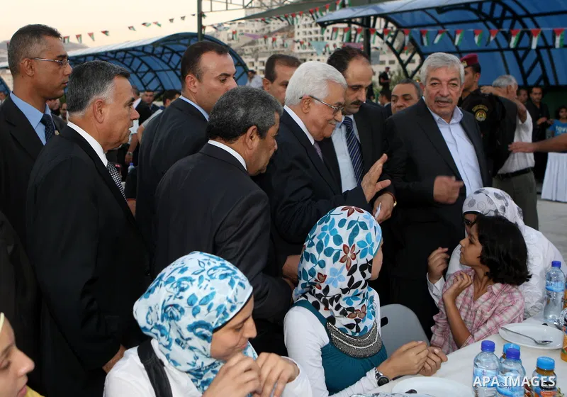 Palestinian President, Mahmoud Abbas (Abu Mazen), participates in breakfast with the group of Palestinian orphans in the West Bank city of Nablus on, Aug. 07, 2012. Photo by Thaer Ganaim