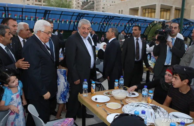 Palestinian President, Mahmoud Abbas (Abu Mazen), participates in breakfast with the group of Palestinian orphans in the West Bank city of Nablus on, Aug. 07, 2012. Photo by Thaer Ganaim