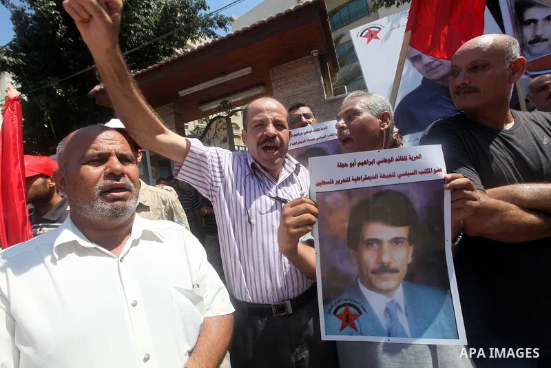 Palestinians participate a protest to calling the release of Palestinian prisoner Ibrahim Abu Hijleh from Israeli jailed, in front of the Red Cross in Gaza city, on Aug. 09, 2012. Photo by Majdi Fathi