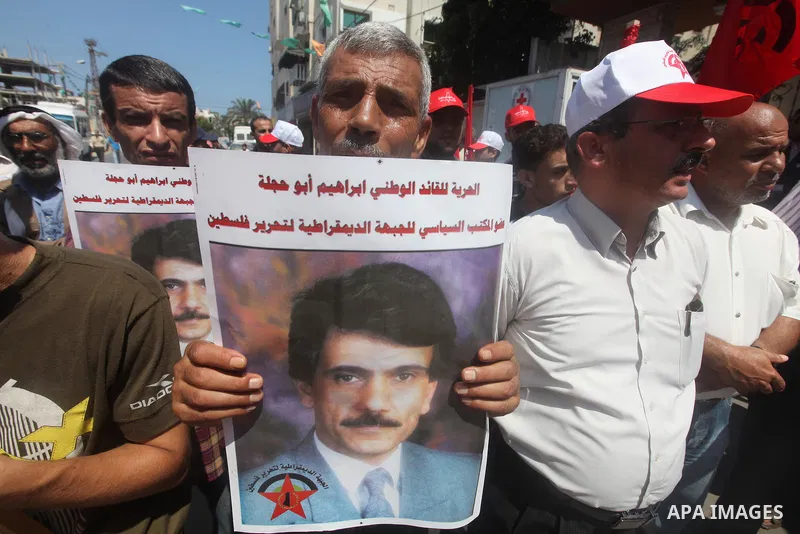 Palestinians participate a protest to calling the release of Palestinian prisoner Ibrahim Abu Hijleh from Israeli jailed, in front of the Red Cross in Gaza city, on Aug. 09, 2012. Photo by Majdi Fathi