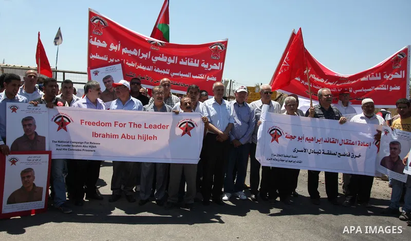 Palestinians hurl stones at Israeli troops, not seen, during a Democratic Front for the Liberation of Palestine (DFLP) demonstration supporting prisoners in Israeli jails outside the Ofer military prison, near the West B...