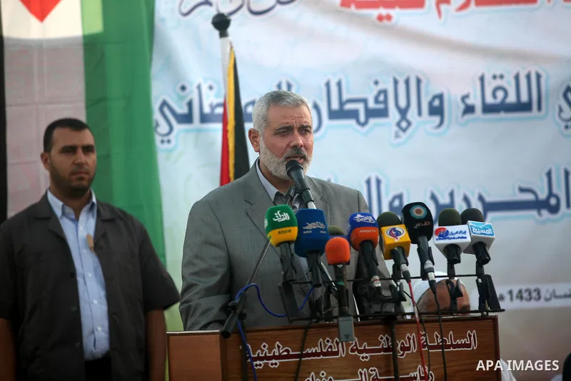 Palestinian Prime Minister in Gaza Strip, Ismail Haniyeh, breaks his fast with a Palestinian released Prisoners during the holy month of Ramadan, in Gaza city on 09 August 2012. Photo by Majdi Fathi