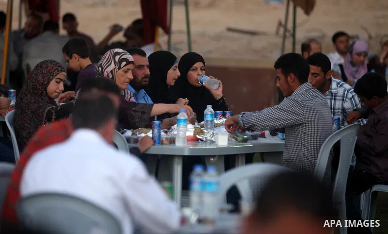 Palestinian Prime Minister in Gaza Strip, Ismail Haniyeh, breaks his fast with a Palestinian released Prisoners during the holy month of Ramadan, in Gaza city on 09 August 2012. Photo by Majdi Fathi