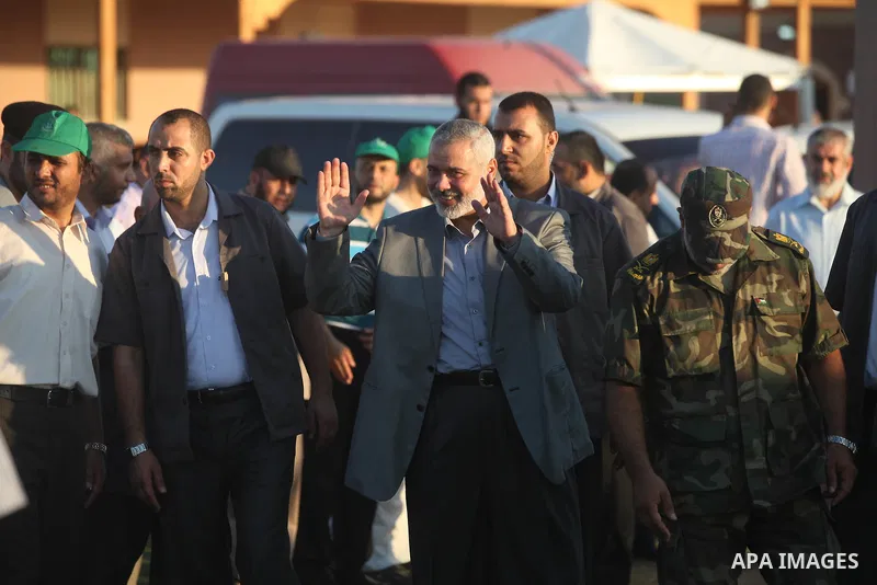 Palestinian Prime Minister in Gaza Strip, Ismail Haniyeh, breaks his fast with a Palestinian released Prisoners during the holy month of Ramadan, in Gaza city on 09 August 2012. Photo by Majdi Fathi