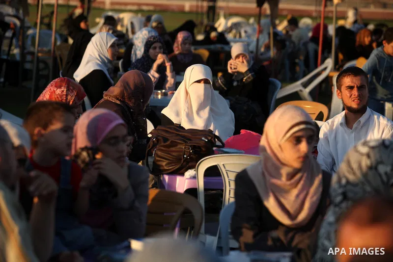 Palestinian Prime Minister in Gaza Strip, Ismail Haniyeh, breaks his fast with a Palestinian released Prisoners during the holy month of Ramadan, in Gaza city on 09 August 2012. Photo by Majdi Fathi