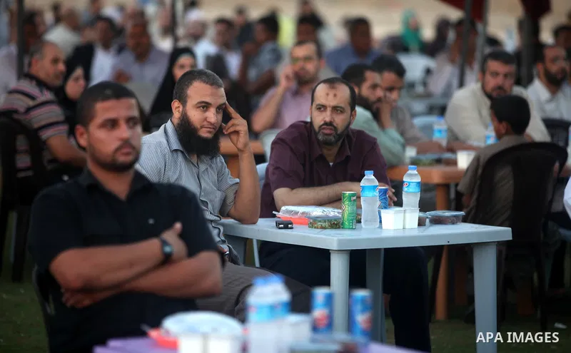 Palestinian Prime Minister in Gaza Strip, Ismail Haniyeh, breaks his fast with a Palestinian released Prisoners during the holy month of Ramadan, in Gaza city on 09 August 2012. Photo by Majdi Fathi