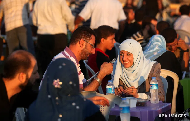 Palestinian Prime Minister in Gaza Strip, Ismail Haniyeh, breaks his fast with a Palestinian released Prisoners during the holy month of Ramadan, in Gaza city on 09 August 2012. Photo by Majdi Fathi