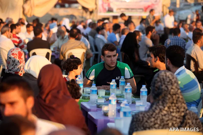 Palestinian Prime Minister in Gaza Strip, Ismail Haniyeh, breaks his fast with a Palestinian released Prisoners during the holy month of Ramadan, in Gaza city on 09 August 2012. Photo by Majdi Fathi