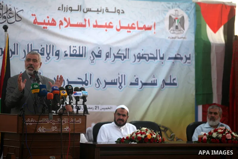 Palestinian Prime Minister in Gaza Strip, Ismail Haniyeh, breaks his fast with a Palestinian released Prisoners during the holy month of Ramadan, in Gaza city on 09 August 2012. Photo by Majdi Fathi