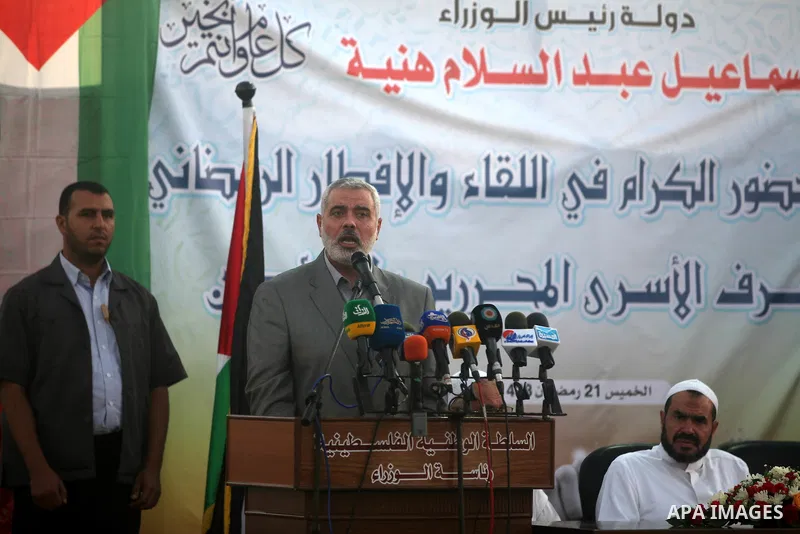 Palestinian Prime Minister in Gaza Strip, Ismail Haniyeh, breaks his fast with a Palestinian released Prisoners during the holy month of Ramadan, in Gaza city on 09 August 2012. Photo by Majdi Fathi