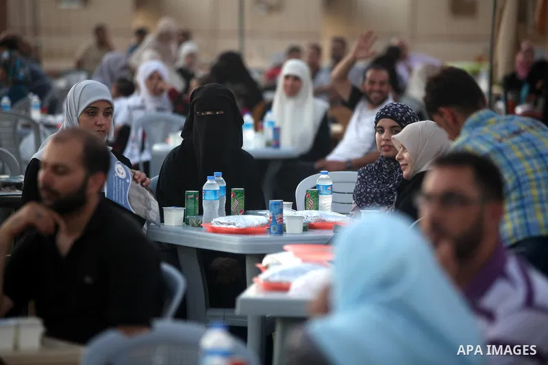 Palestinian Prime Minister in Gaza Strip, Ismail Haniyeh, breaks his fast with a Palestinian released Prisoners during the holy month of Ramadan, in Gaza city on 09 August 2012. Photo by Majdi Fathi