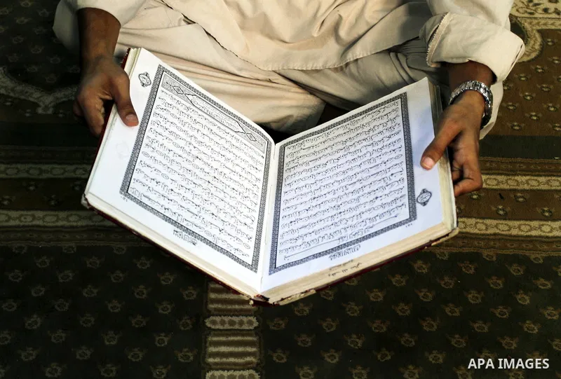 A Palestinian reads the Holy Koran in the Al-Omari mosque in the Gaza Strip, 09 August 2012. Muslims throughout the world prepare to celebrate the Eid al-Fitr festival after the Holy fasting month of Ramadan, in which th...