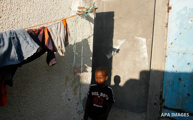 Palestinian children play in front of their house in Rafah refugee camp southern Gaza Strip, on 11 August 2012. Photo by Eyad Al Baba