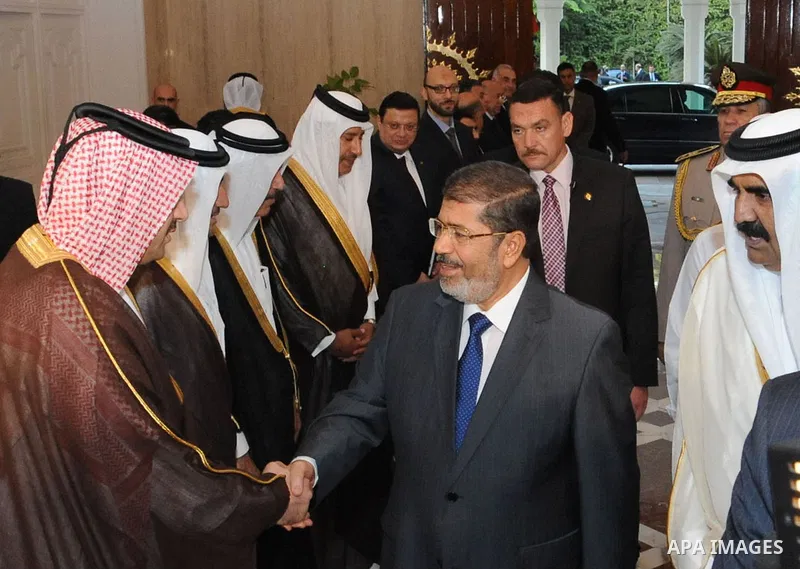 Egypt's President Mohamed Mursi, meets with Qatar's Emir Sheikh Hamad bin Khalifa al-Thani at the presidential palace in Cairo, August 11, 2012. Qatar said on Saturday it would deposit $2 billion at the Egyptian Central...