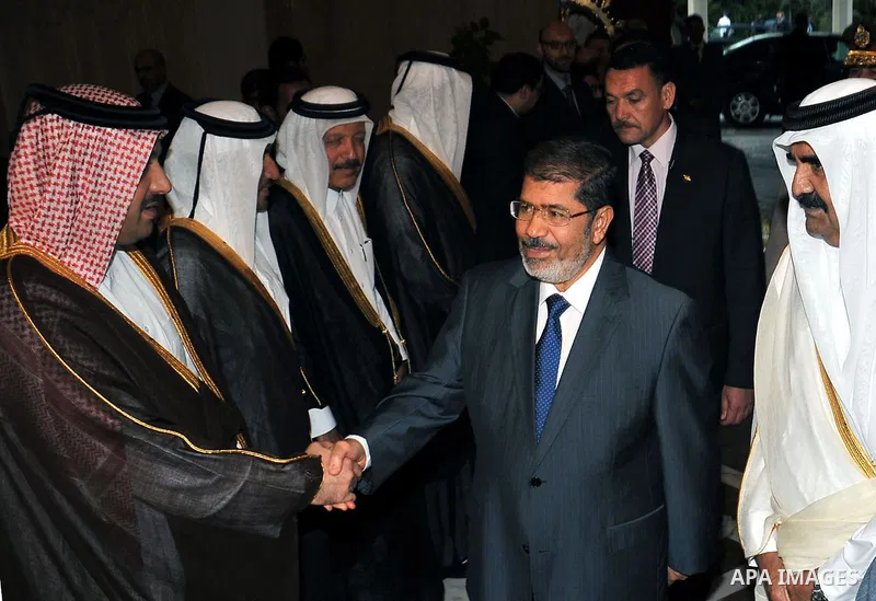 Egypt's President Mohamed Mursi, meets with Qatar's Emir Sheikh Hamad bin Khalifa al-Thani at the presidential palace in Cairo, August 11, 2012. Qatar said on Saturday it would deposit $2 billion at the Egyptian Central...