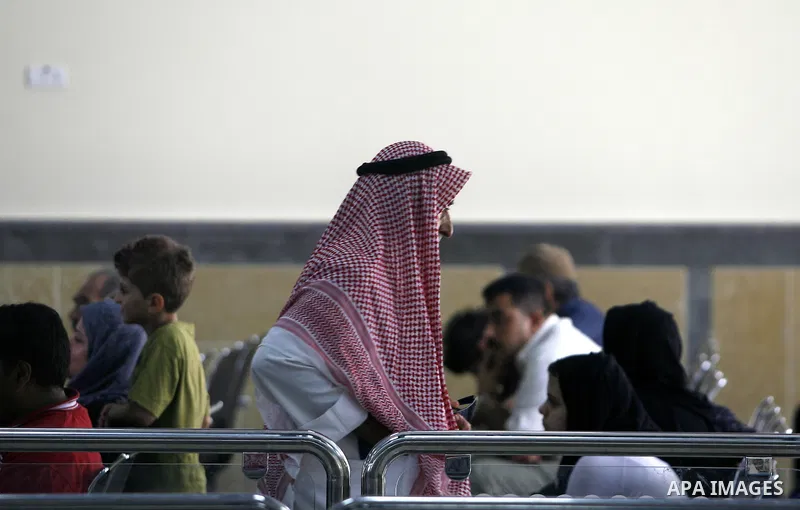Palestinian passengers wait at a station in Khan Younis in the southern Gaza Strip, before entering Egypt through Rafah border crossing August 14, 2012. Egypt opened the crossing temporarily on Tuesday, but just for thre...